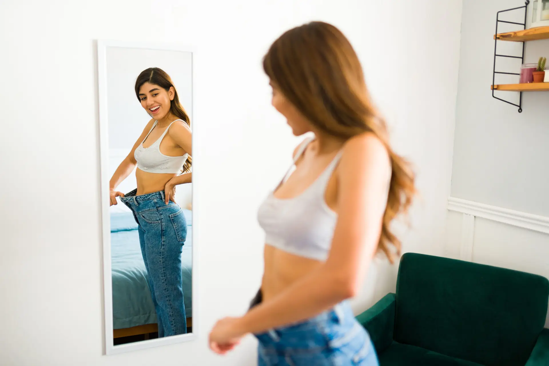 Cheerful woman can wear smaller sizes of her clothes