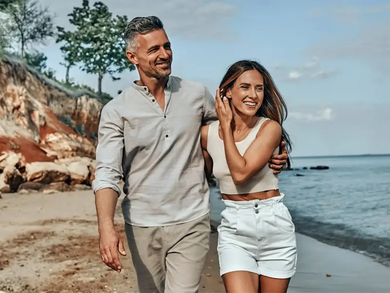 Couple on beach happy.